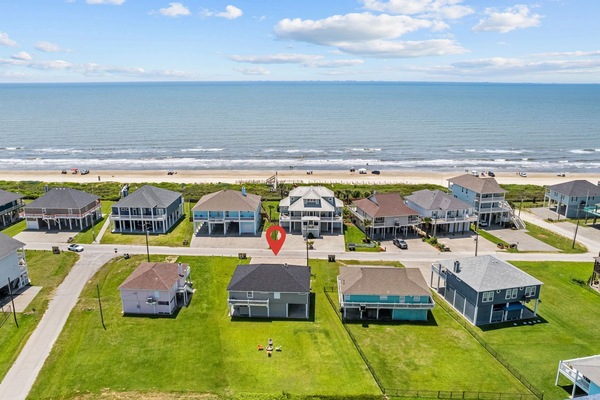 Close to beach with walk on and golf cart access. Large yard with stone firepit.