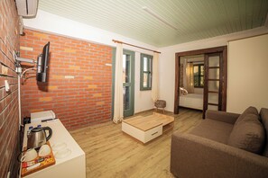 Design Apartment, 1 King Bed with Sofa bed, Courtyard View, Garden Area | Living area - Paradise Imroz (Gökçeada)