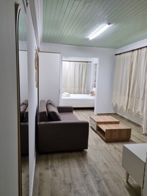 Design Apartment, 1 King Bed with Sofa bed, Courtyard View, Garden Area | Living area | 82-cm Smart TV with satellite channels, TV - Paradise Imroz (Gökçeada)