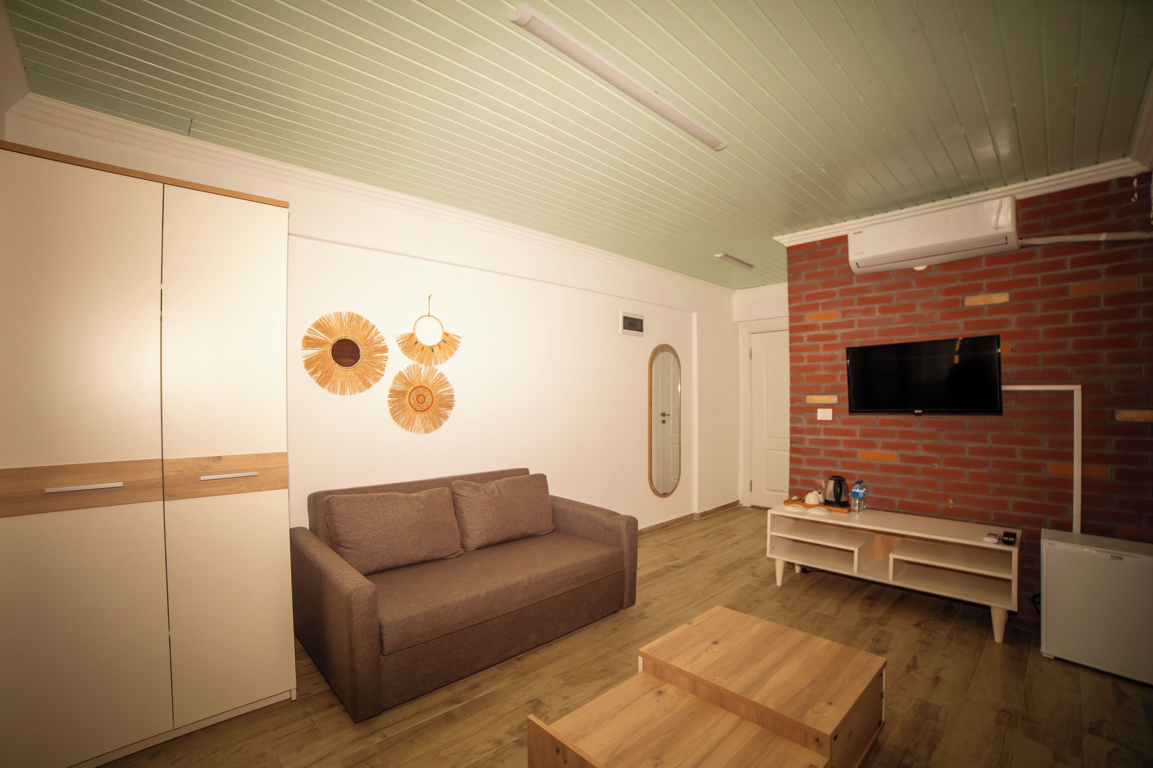 Design Apartment, 1 King Bed with Sofa bed, Courtyard View, Garden Area | Living room | 82-cm Smart TV with satellite channels, TV