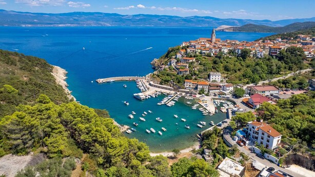 A coastal town with a marina, buildings, and a prominent tower. - Villa Giulietta with a heated pool, fitness & Seaview (Vrbnik (Krk))