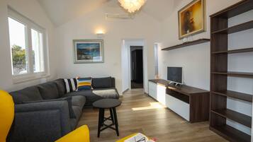 Superior Apartment, 2 Bedrooms, Sea View | Living area | 32-inch LED TV with cable channels, TV, heated floors