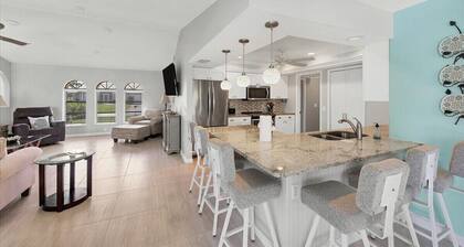Walkin on Sunshine - canal front home with pool mins to golf and beaches