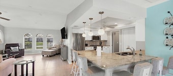 Walkin on Sunshine - canal front home with pool mins to golf and beaches