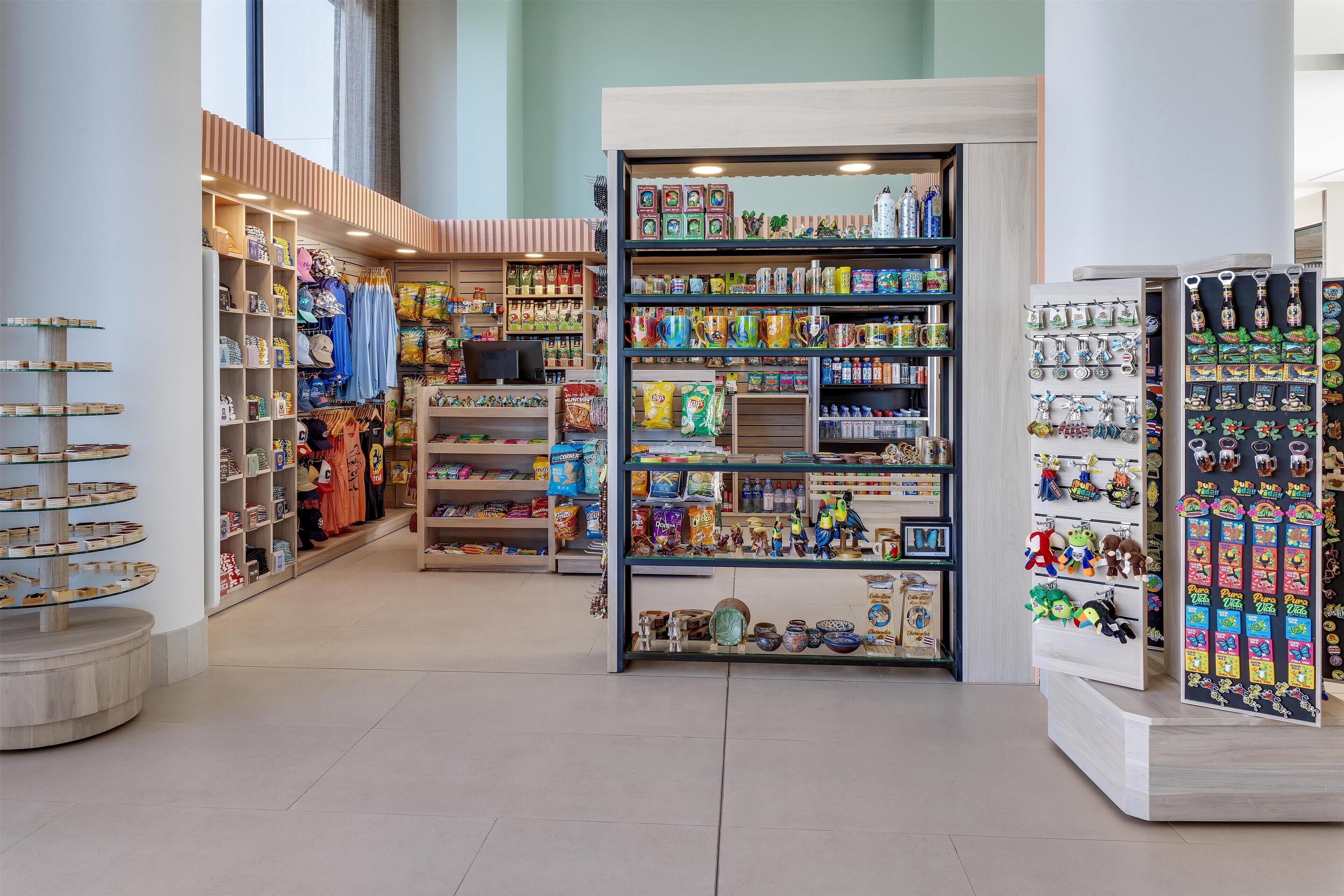 A store with shelves stocked with various items, including snacks, toys, and decorative objects.