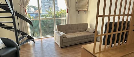 Traditional Apartment | Living area | 40-inch flat-screen TV with digital channels, TV