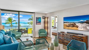 Luxury Condo | Living area | 50-inch Smart TV with cable channels