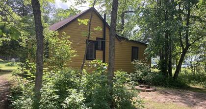 Cozy 1950’s lake front cabin with beautiful sunsets!