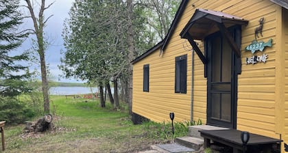 Cozy 1950’s lake front cabin with beautiful sunsets!