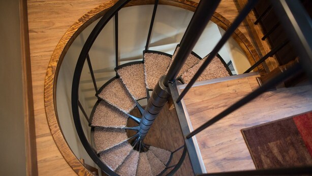 A spiral staircase with wooden steps and metal railings. - Trophy Buck sleeps 6, or rent all 4 for 20. Horseback riding across the Rd! (Laurelville)