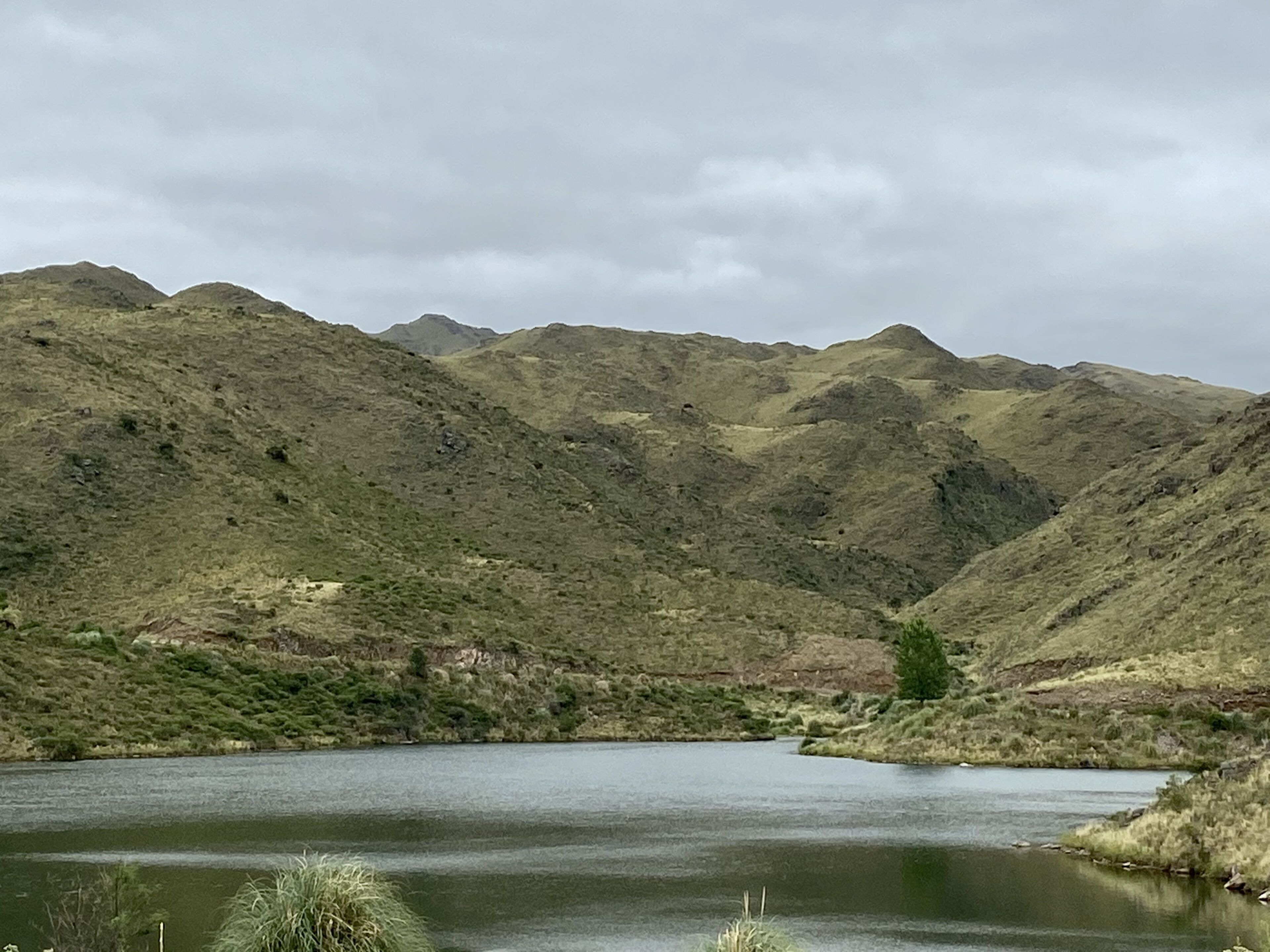 A mountainous landscape with a lake.