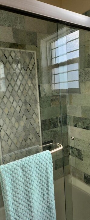 Shower, hair dryer, towels, soap