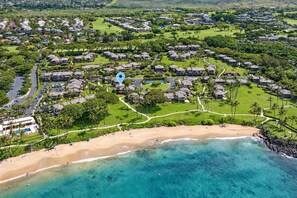 A coastal resort with beachfront properties, a golf course, and a central building marked by a blue pin. - Luxurious Oceanfront Condo at Wailea Elua Village - Unit 1201, Central AC, Wi-Fi (Kihei)