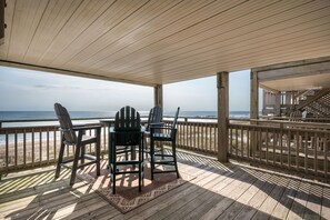 Outdoor dining - Dog-friendly oceanfront condo, 2 bedrooms plus bonus room, expansive oceanfront decks! (Kill Devil Hills)