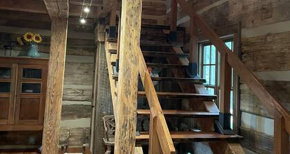 Prospect Mountain Cabin custom log home sportsman's paradise with fishing lake.