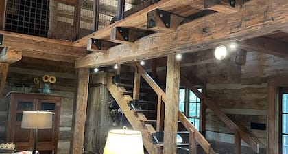 Prospect Mountain Cabin custom log home sportsman's paradise with fishing lake.
