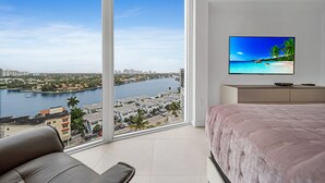 A bedroom with a large window overlooking a marina and cityscape. - Ocean view Amazing 3BR at Tiffany House (Fort Lauderdale)