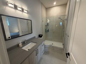 Shower, hair dryer, towels, soap