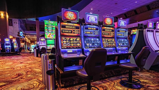 A casino floor with slot machines and gaming chairs. - Casa Feliz is minutes from Colorado River, Oatman, Casinos, Laughlin. (Fort Mohave)