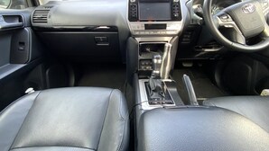 A car's interior with a central console, steering wheel, and two seats. - Beach House With bay Views and Swimming Pool (Mount Martha)
