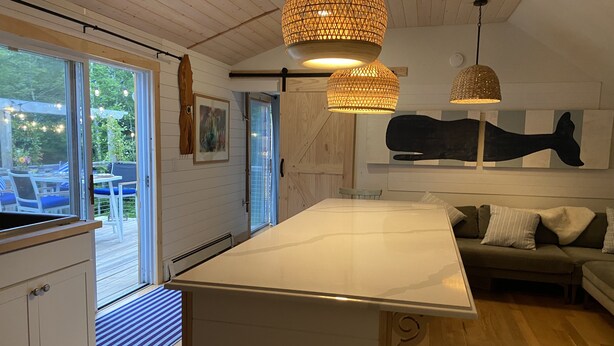 A modern kitchen with a large island, wooden flooring, and pendant lighting. - Cute Loft , Ideal Location to Bayside Camden and Belfast
Day trip to Bar Harbor! (Northport)