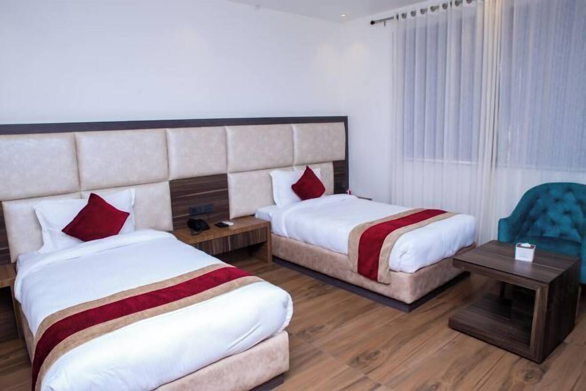 Premium bedding, desk, laptop workspace, soundproofing
