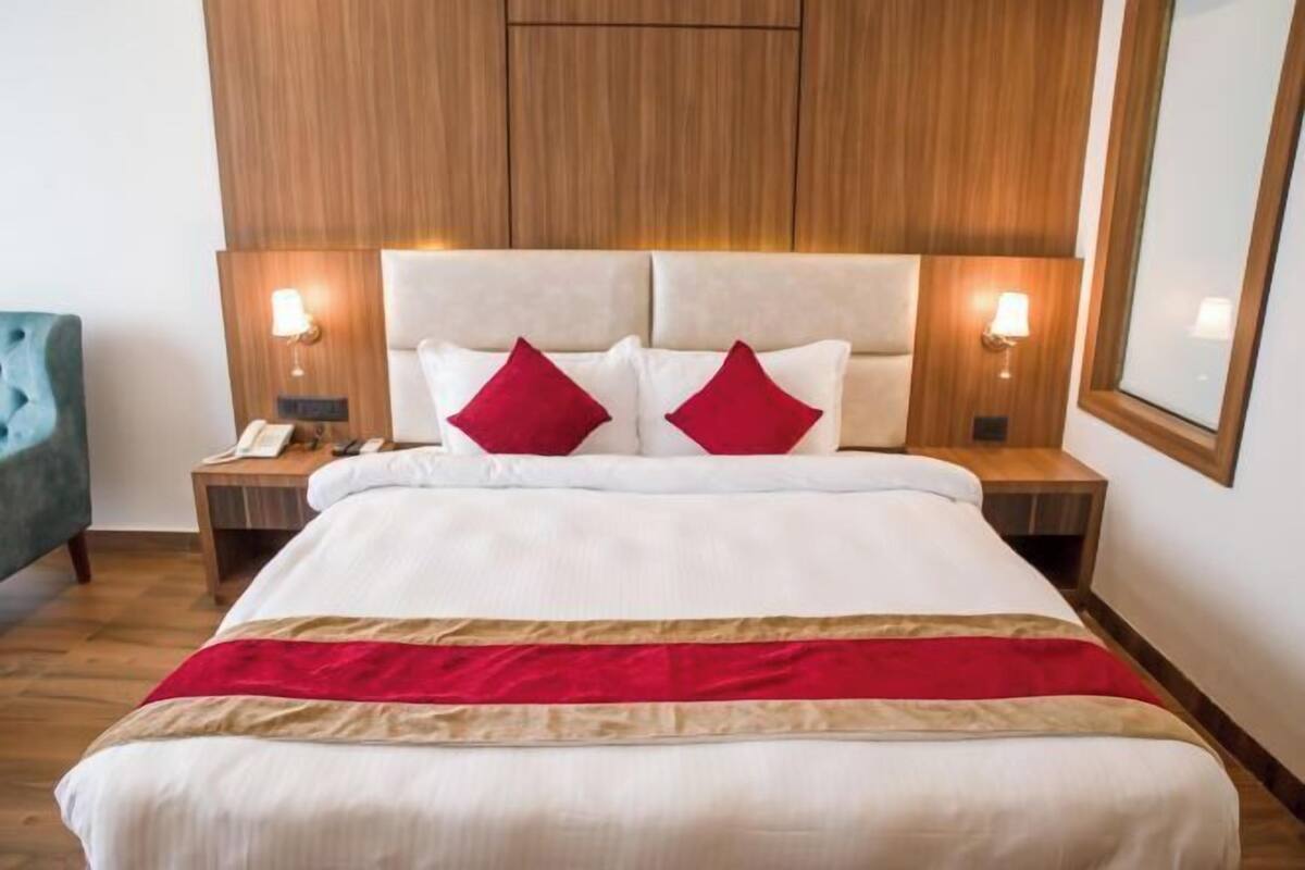 Premium bedding, desk, laptop workspace, soundproofing