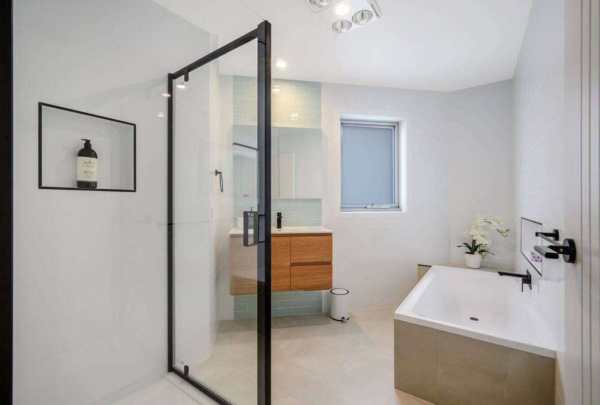Bathtub, hair dryer, towels, shampoo