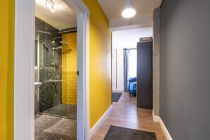 Family Triple Room | Bathroom | Shower, free toiletries, hair dryer, slippers