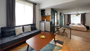 A modern apartment with a living room, kitchenette, and bedroom. - Cabbana Hotel Lara (Antalya)