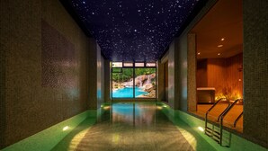 A spa area with a starry ceiling, a pool, and a view of a natural landscape. - AD HOTEL HYDRA (Algiers)
