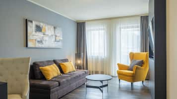 Business Suite, Balcony | Living area | 65-inch flat-screen TV with digital channels, TV, offices