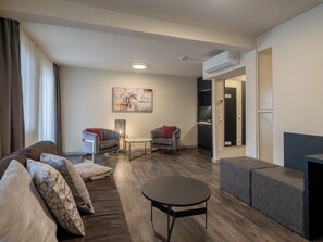 Business Suite, Balcony | Living area | 65-inch flat-screen TV with digital channels, TV, offices -  Hotel INNSENTO Passau (Passau)