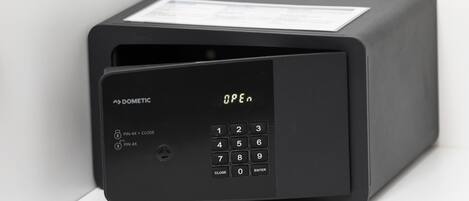 A black, rectangular device with a keypad and a label that reads "OPEN".