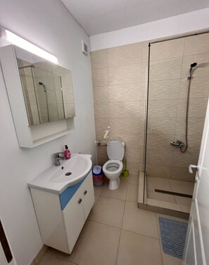 Shower, hair dryer, soap, shampoo