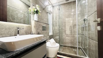 Shower, hair dryer, towels, soap