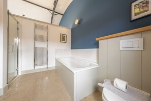 Bathtub, hair dryer, towels