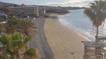 On the beach, sun loungers, beach towels