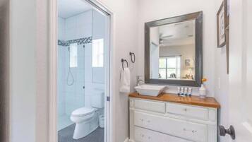 Shower, hair dryer, towels, shampoo
