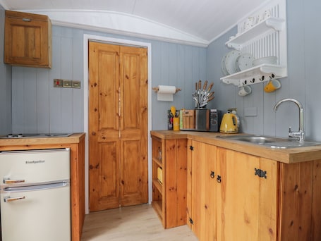 Fridge, electric kettle, toaster, cookware/dishes/utensils. Rabbit Hill Hut