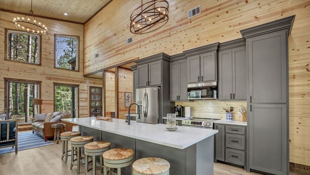 A spacious kitchen with a large island, grey cabinets, and a wooden ceiling. - Forever In Blue Jeans in Hochatown/Broken Bow,OK (Broken Bow)