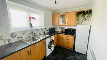 Comfort Apartment | Private kitchen | Fridge, microwave, oven, stovetop