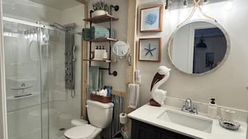Shower, hair dryer, towels, soap