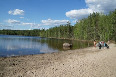 Log cabin. Ramsjö Camping . Ångevägen 24. Timber log nearby river stream