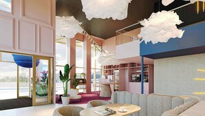 A modern interior with a seating area, a coffee table, and a large window. - Ibis Styles Rotterdam Ahoy (Rotterdam)