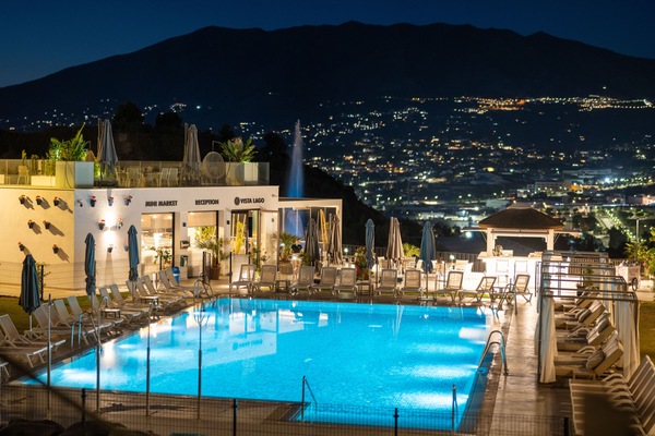 Outdoor pool, a heated pool, open 10:00 AM to 10:00 PM, pool umbrellas