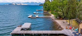 Lakefront home with private beach, dock, firepit, & grill - dazzling sunset view