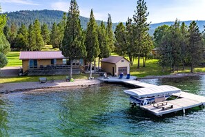 Exterior - Lakefront home with private beach, dock, firepit, & grill - dazzling sunset view (Big Arm)