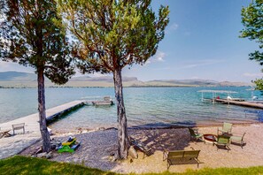 On the beach - Lakefront home with private beach, dock, firepit, & grill - dazzling sunset view (Big Arm)