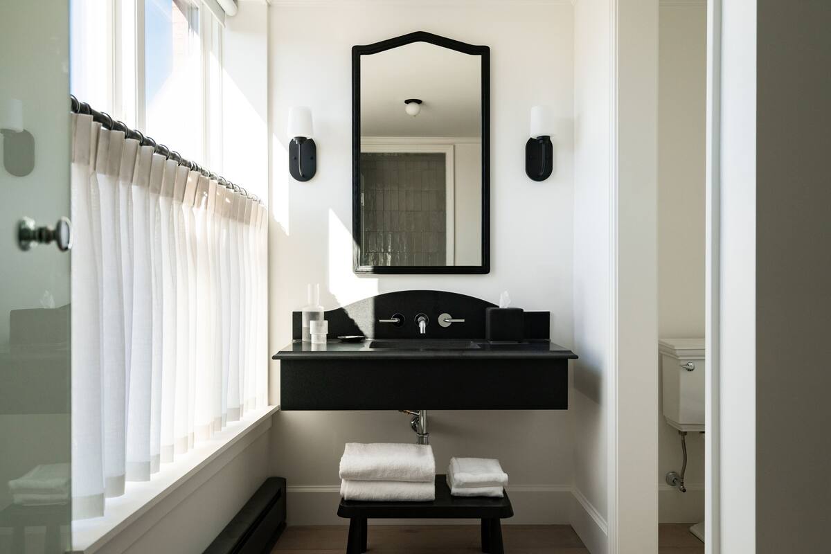 designer toiletries, hair dryer, bathrobes, towels